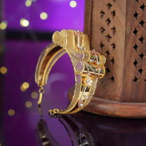 22KT gold bracelet with folded honeycomb-mesh loops, small flowers and beaded sprays in Turkish design.