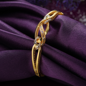 18KT gold bracelet with interlocking glossy oval loops, a key-pattern centre and rhodium-rimmed links.