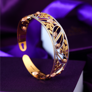 22KT open cuff gold bracelet with leaf and bud cut-outs in yellow gold, rose gold and rhodium