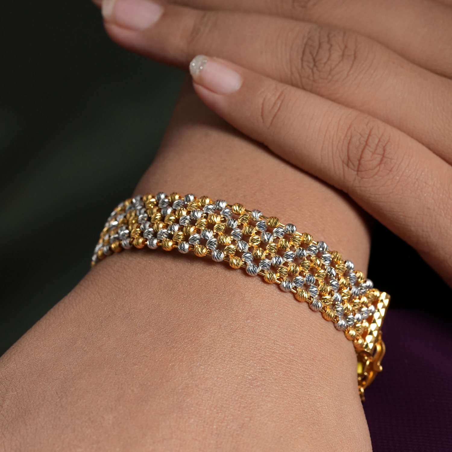 Rowline 22kt gold bracelet by Taqwa Jewellers with multi-row faceted bead construction in gold and rhodium dual-tone.