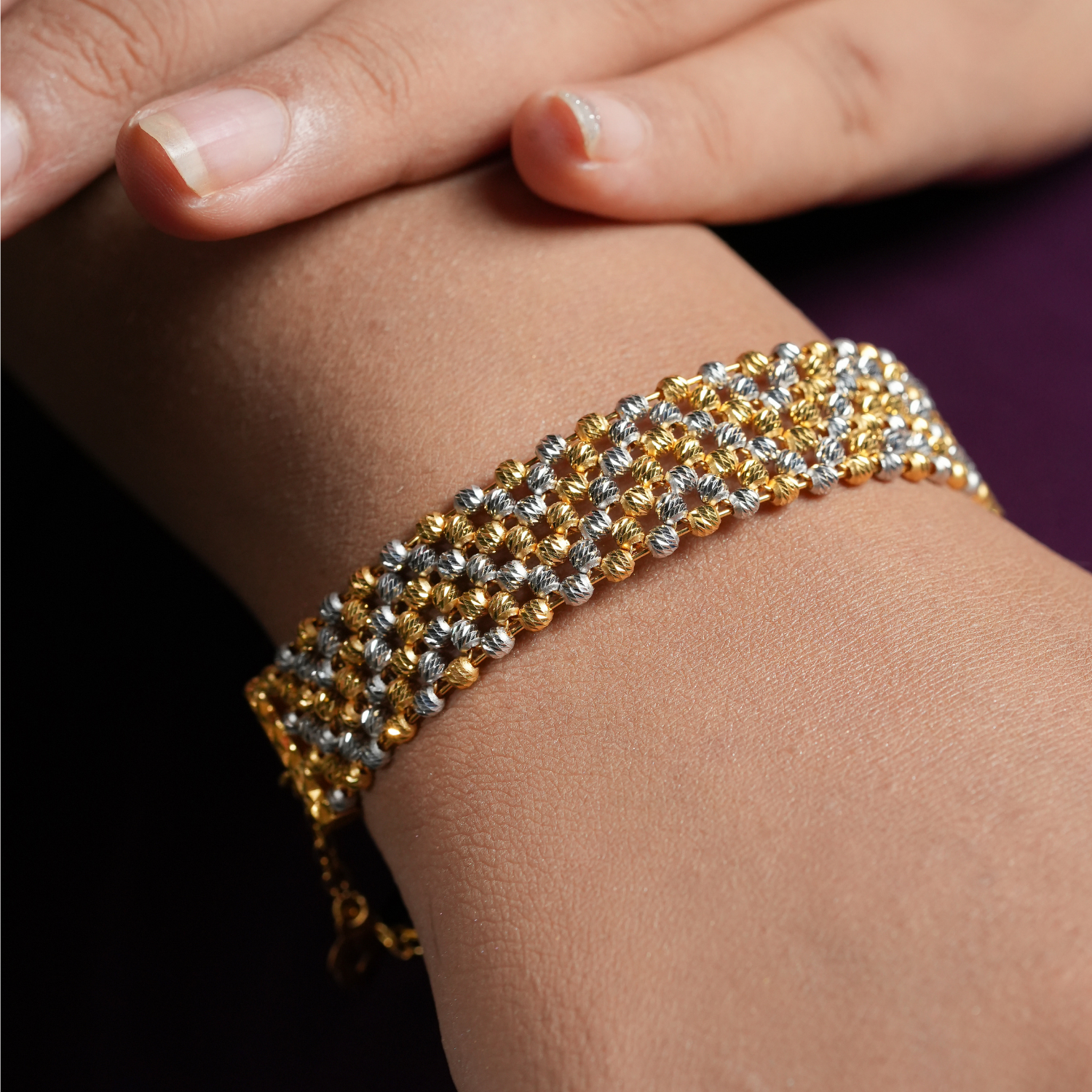 Rowline 22kt gold bracelet by Taqwa Jewellers with multi-row faceted bead construction in gold and rhodium dual-tone.