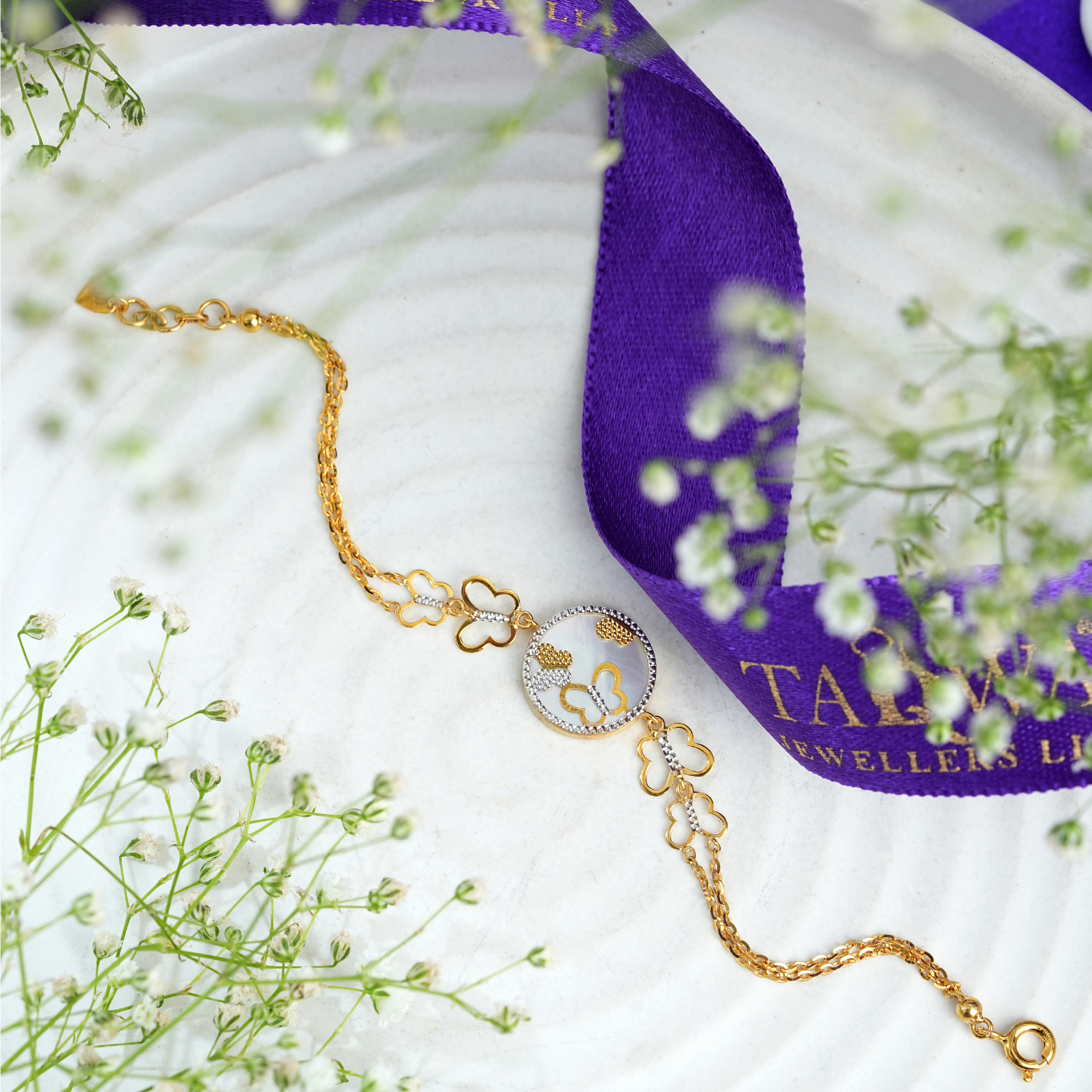 Qalbeen 18kt gold bracelet by Taqwa Jewellers with a heart-motif medallion and stone-lined heart-shaped chain links.