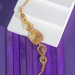 18KT gold bracelet with an eight-sided star-pattern panel, round spoke medallions and teardrop shapes on a chain.