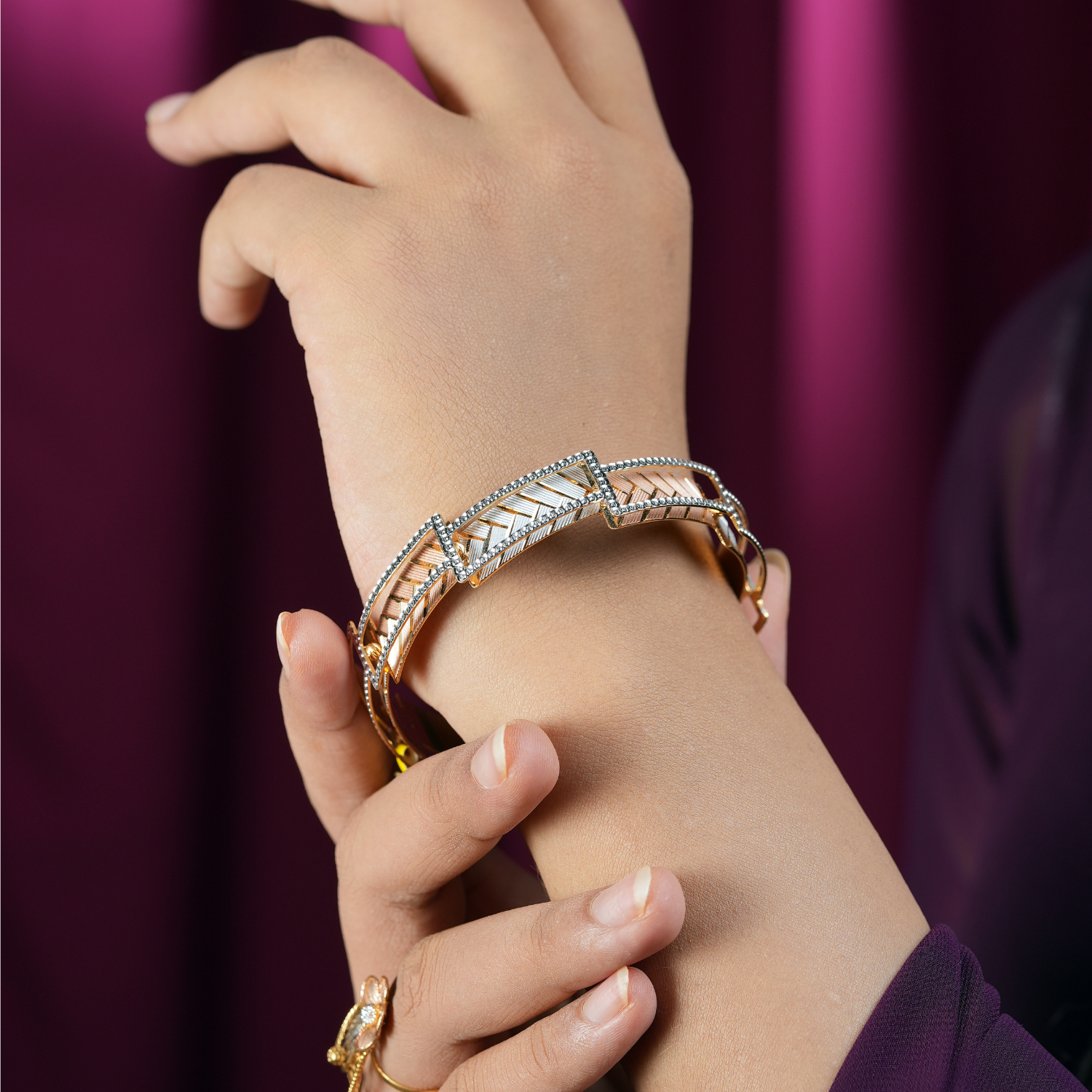 Triora 22KT Gold Bangle with yellow, white and rose gold tones, brushed texture, and CZ detailing.