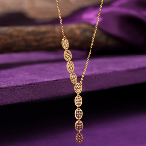 Damask 18KT gold chain with a line of laser-cut oval links and a fine cable chain, by Taqwa Jewellers.