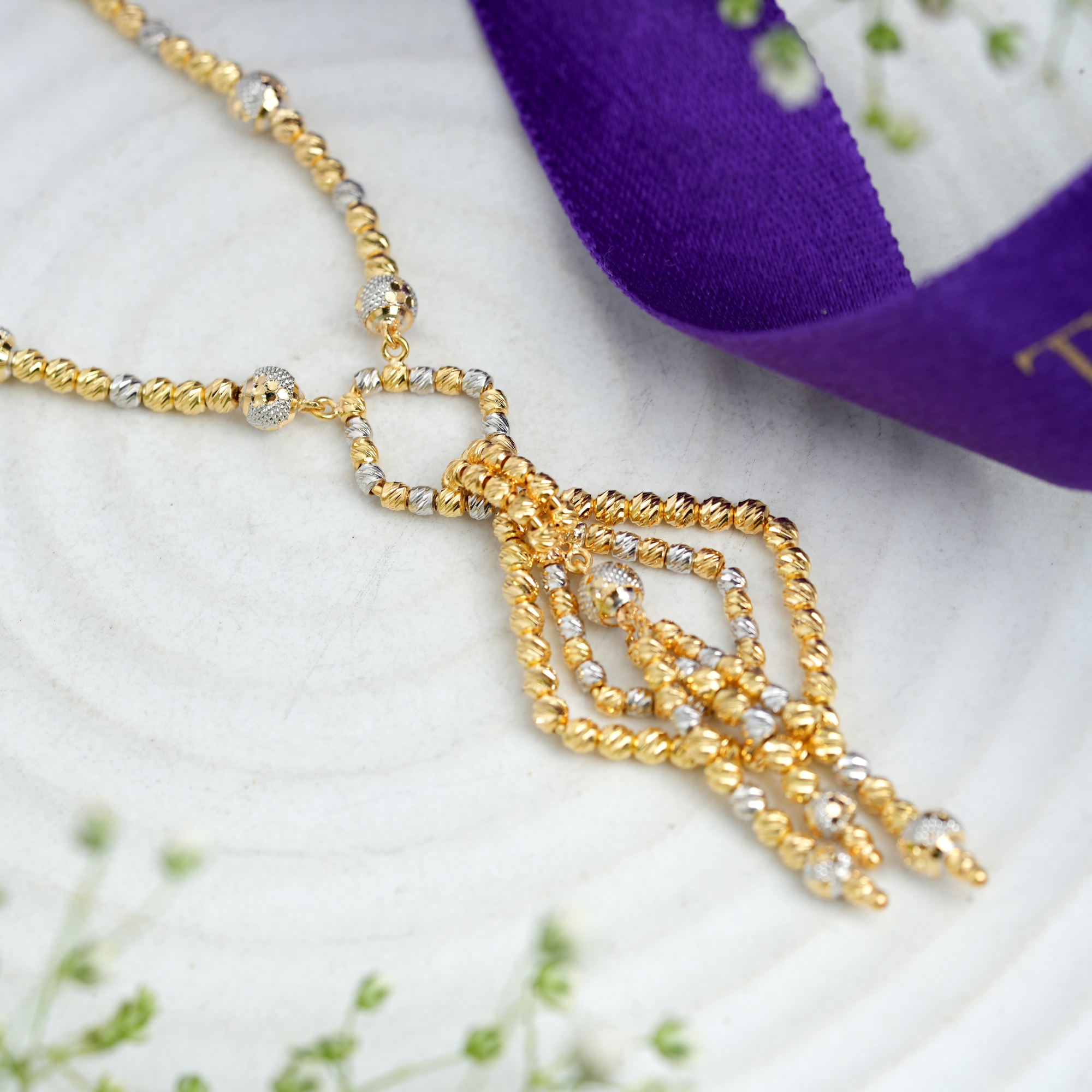 Noor Drop 18KT Gold Chain by Taqwa Jewellers with geometric drop pendant and three tassel details.