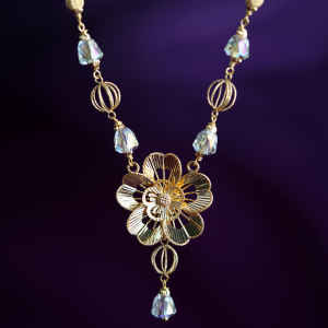 Carillon 18KT gold chain with a flower pendant, faceted glass beads, bead cages and filigree beads, by Taqwa Jewellers.