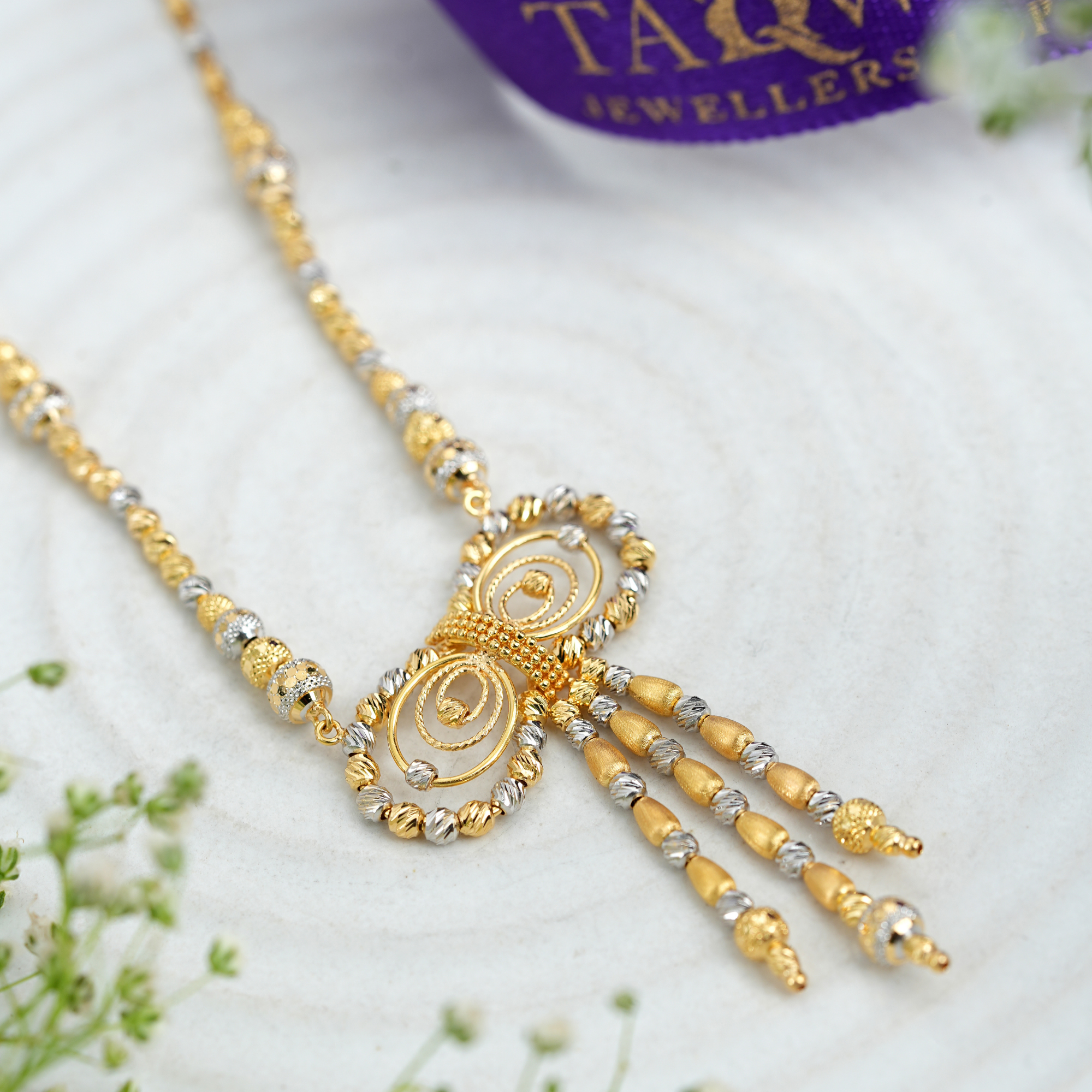 Twin Ribbon 18KT Gold Chain by Taqwa Jewellers.