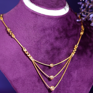 Triple Drop 18KT yellow gold chain with three graduated strands, spherical gold accents, and decorative links by Taqwa Jewellers.