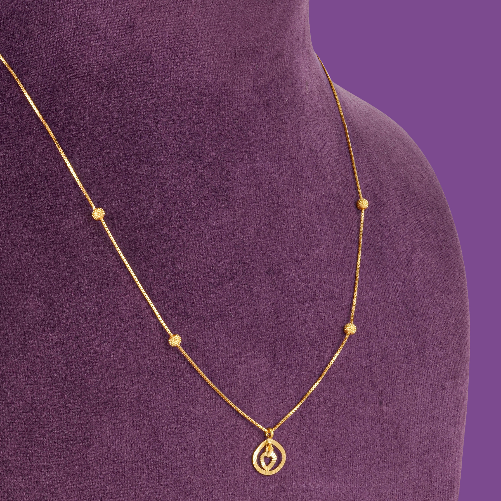Cherish Gold Chain, a 22KT gold box chain with four textured beads and a round heart pendant, by Taqwa Jewellers.