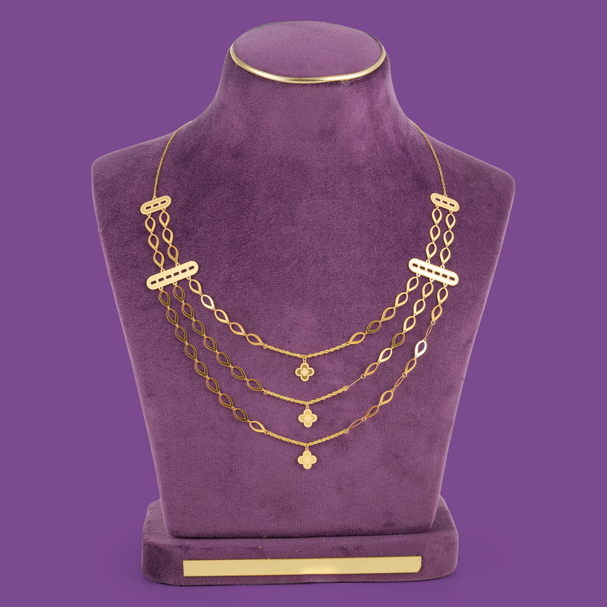 Gleam Gold Necklace Set by Taqwa Jewellers with a three-tier almond-link necklace, bracelet, earrings and ring.