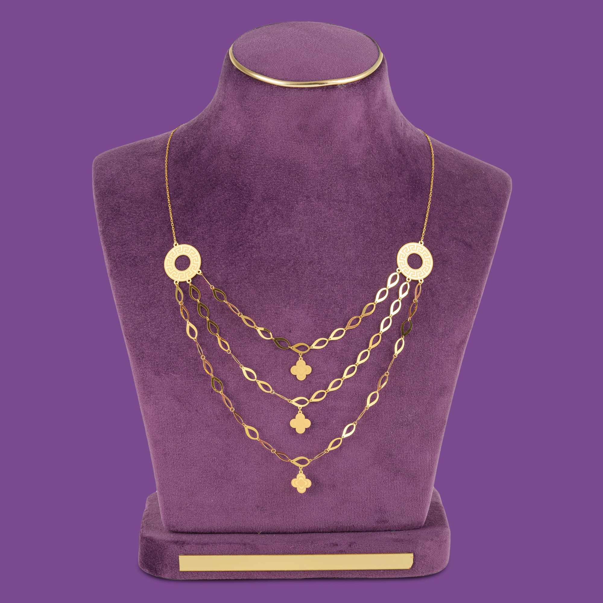 Halo Gold Necklace Set by Taqwa Jewellers with an almond-link necklace, bracelet, ring and earrings on round open discs.