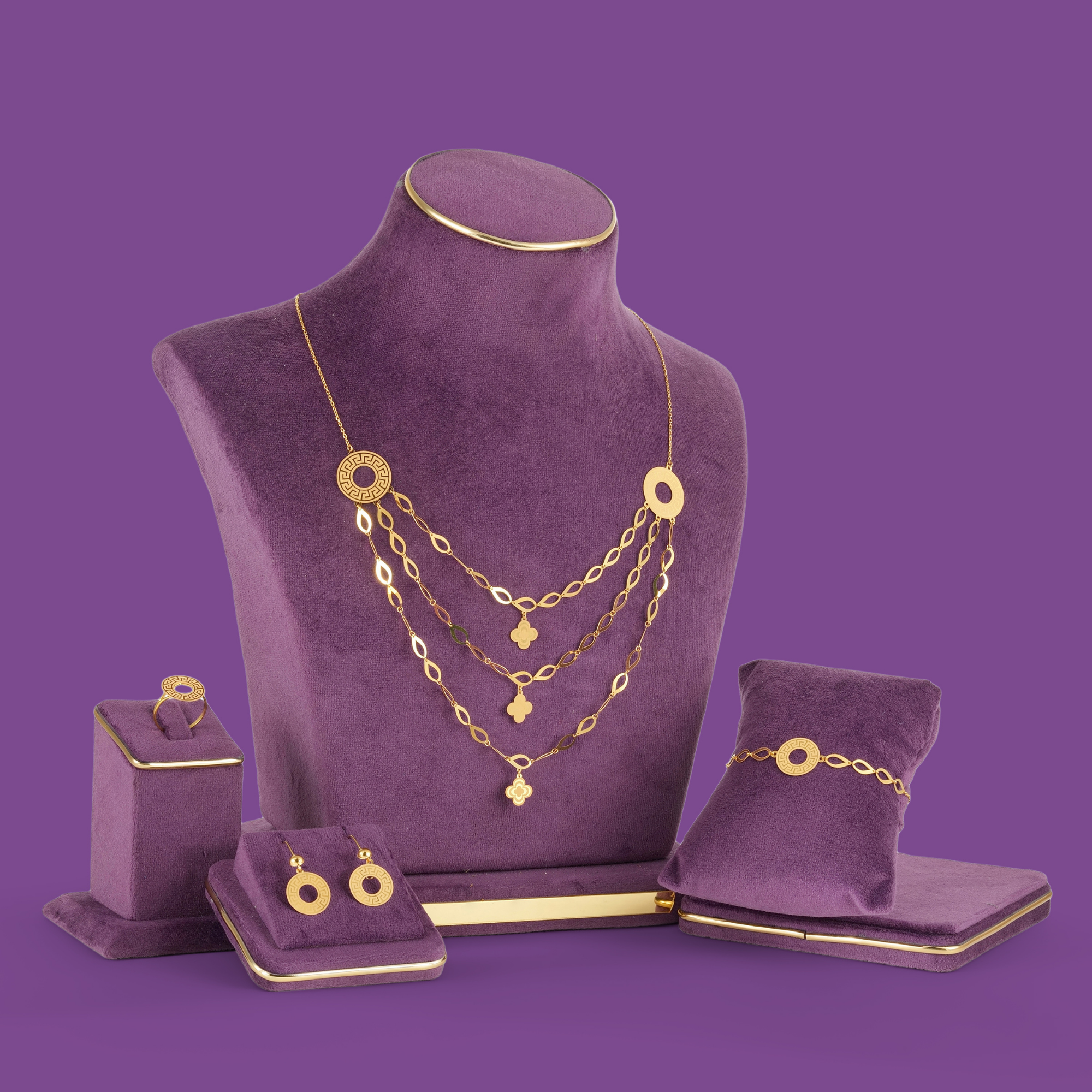 Halo Gold Necklace Set by Taqwa Jewellers with an almond-link necklace, bracelet, ring and earrings on round open discs.