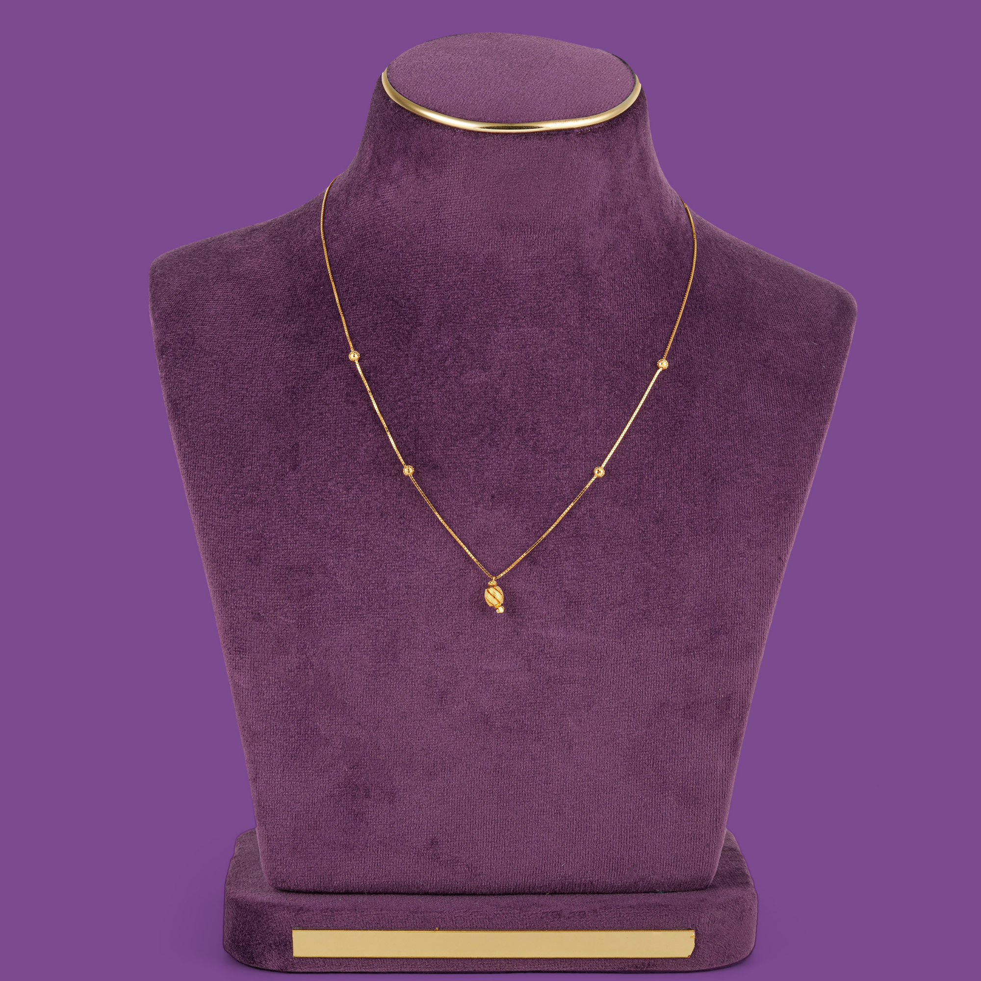 Nectar Gold Chain, a 22KT gold box chain with four round beads and an oval pendant with slanted bands, by Taqwa Jewellers.
