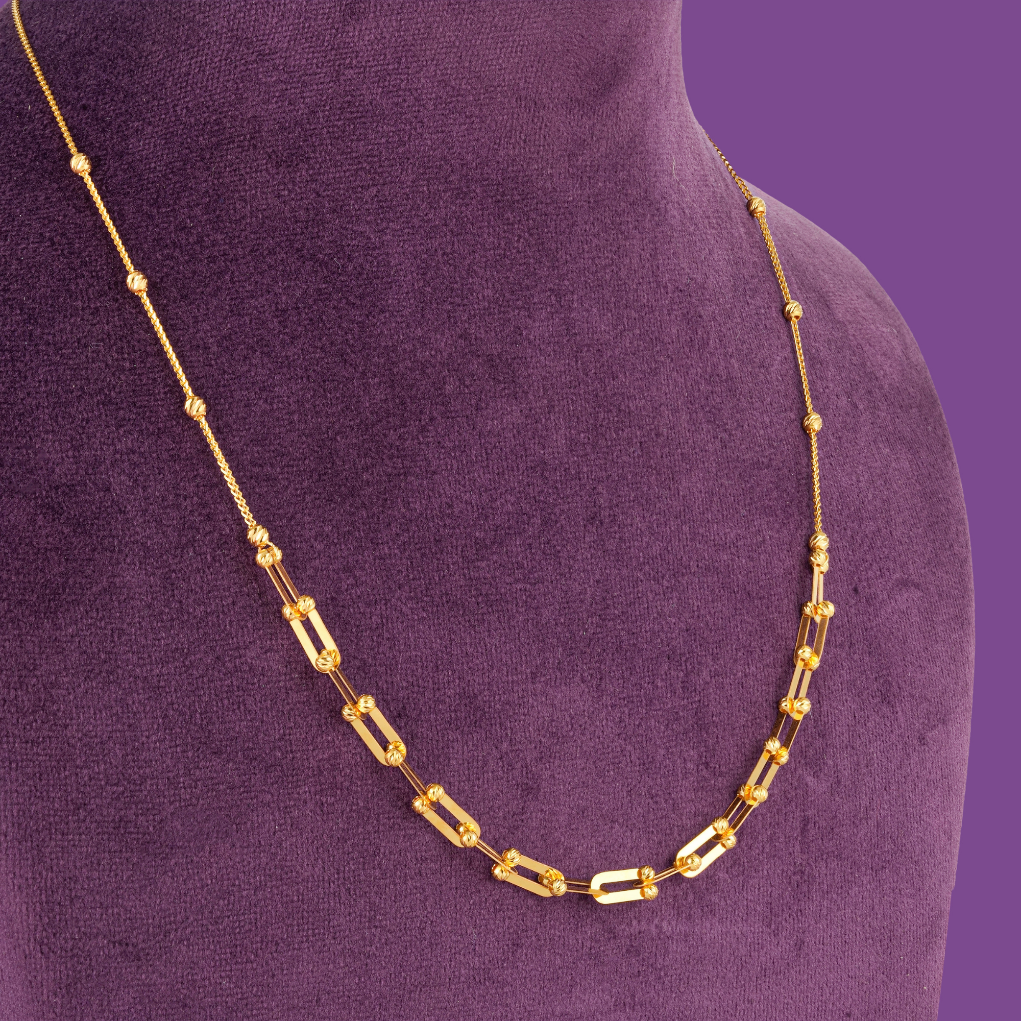 Pivot Gold Necklace Set by Taqwa Jewellers: open links with cut beads, plus bracelet, earrings and a cross ring.
