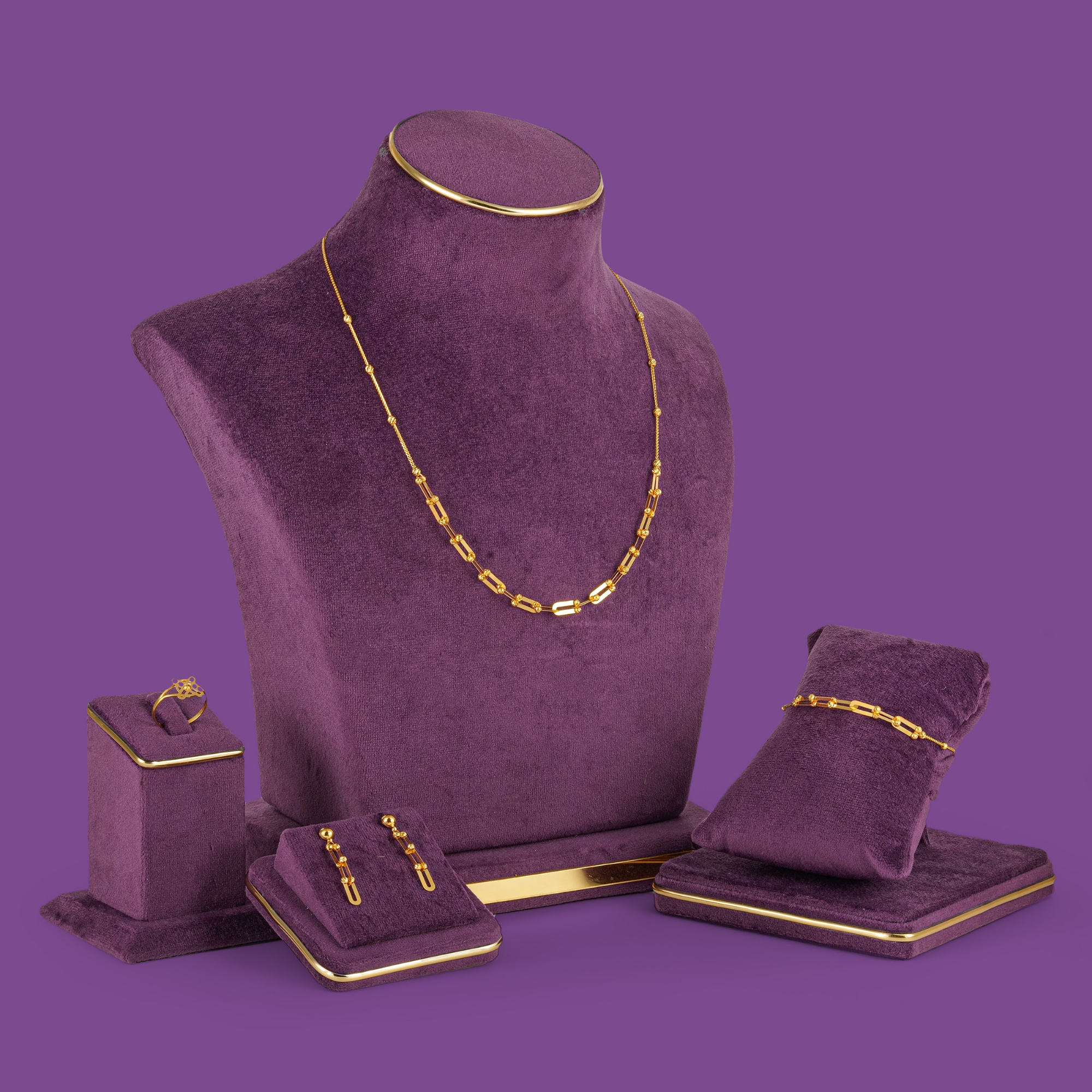 Pivot Gold Necklace Set by Taqwa Jewellers: open links with cut beads, plus bracelet, earrings and a cross ring.