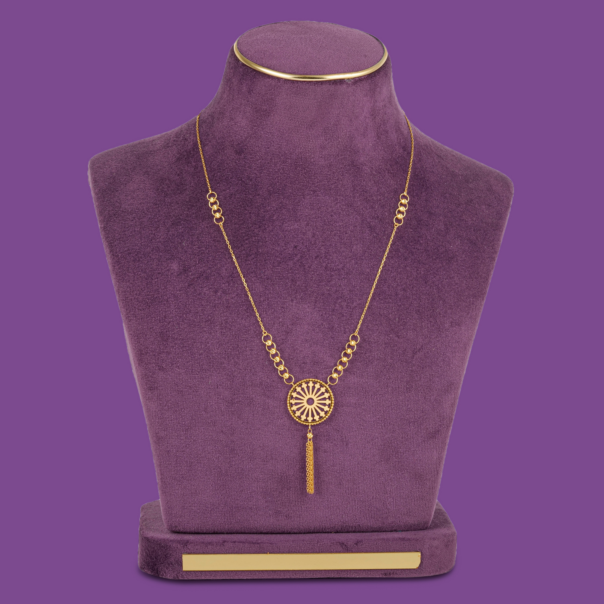 18KT gold necklace set with bracelet, ring and earrings featuring a round spoked medallion with a gold bead border.