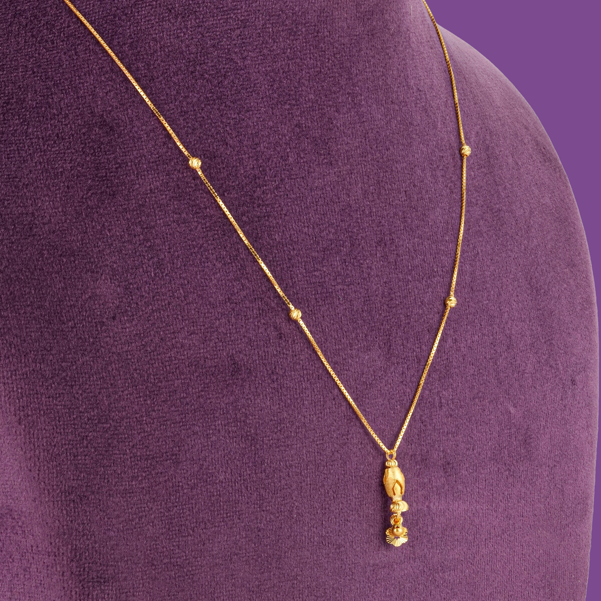 Tulip 22KT gold chain with four cut beads and a stacked bud and fluted flower pendant, by Taqwa Jewellers.