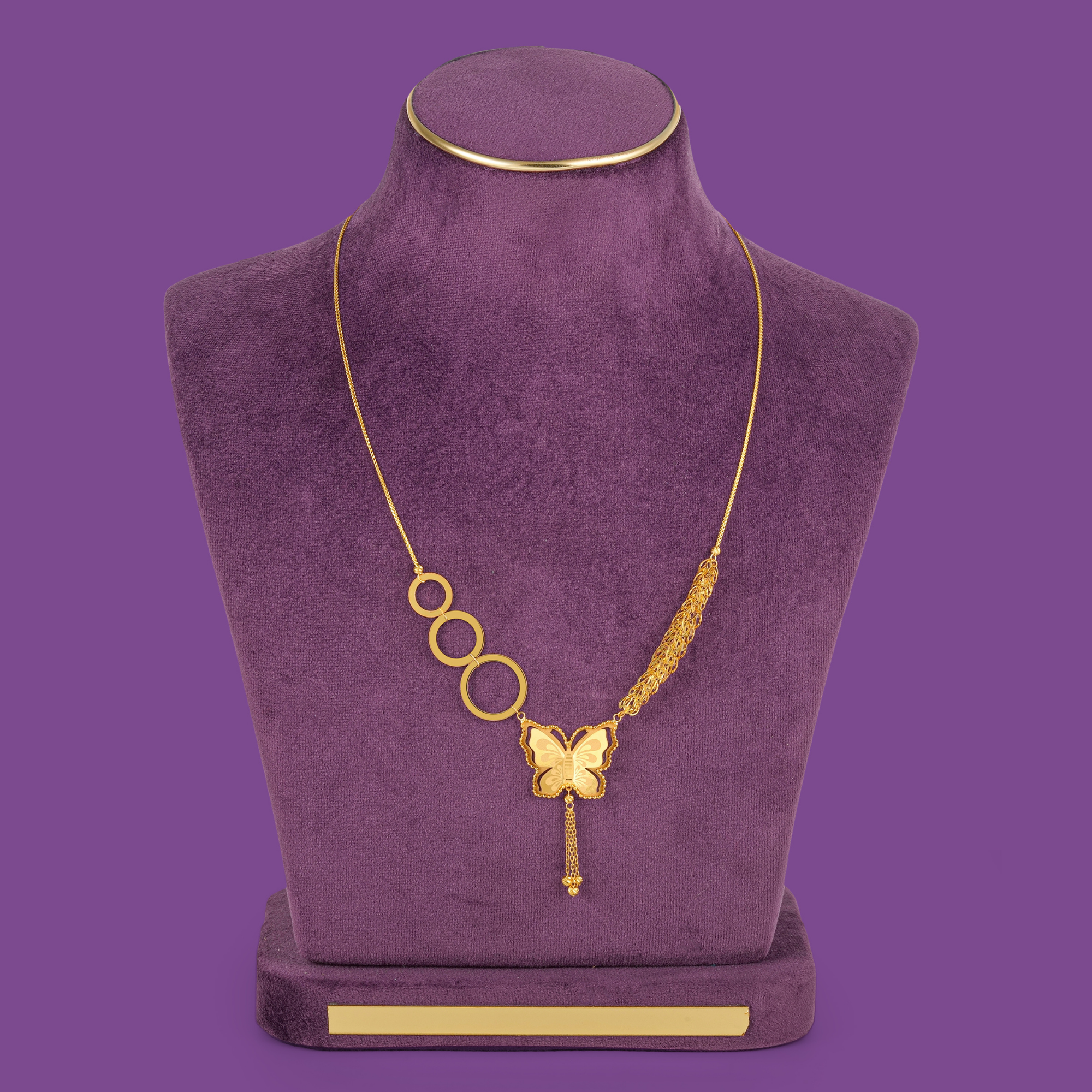 Winglet 18KT gold necklace set featuring a butterfly motif, linked oval elements, matching earrings, bracelet and ring by Taqwa Jewellers.